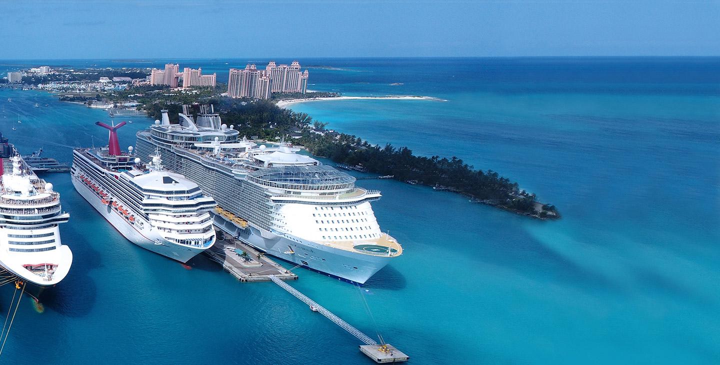 3 large cruise sihps docked at an island using maritime satellite internet